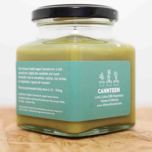 A jar of CBD Cannabutter angled facing the back of the jar