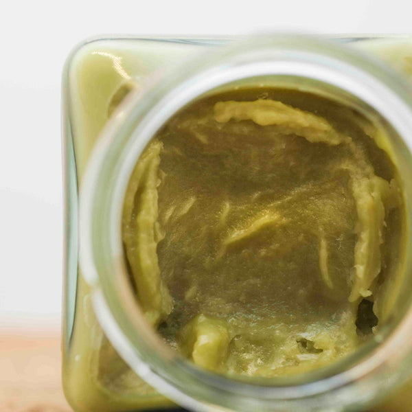 The inside of a jar of Little Collins CBD Cannabutter