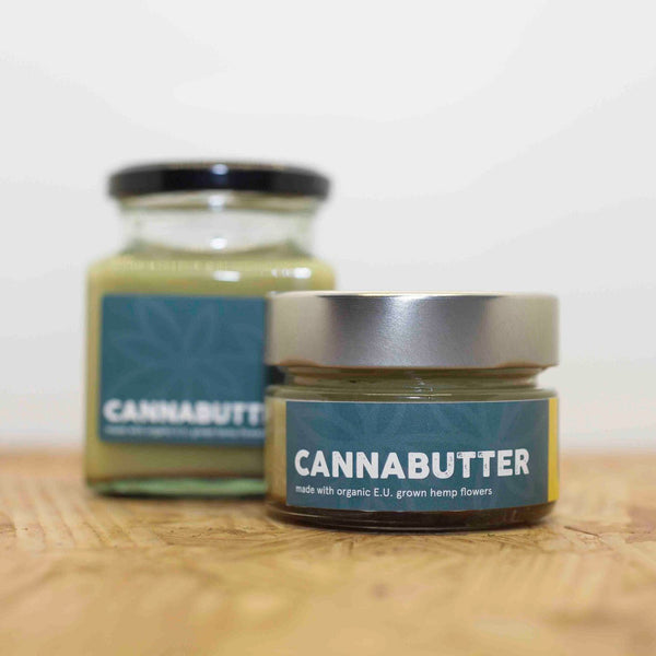 A small and large jar of Little Collins CBD Cannabutter side by side