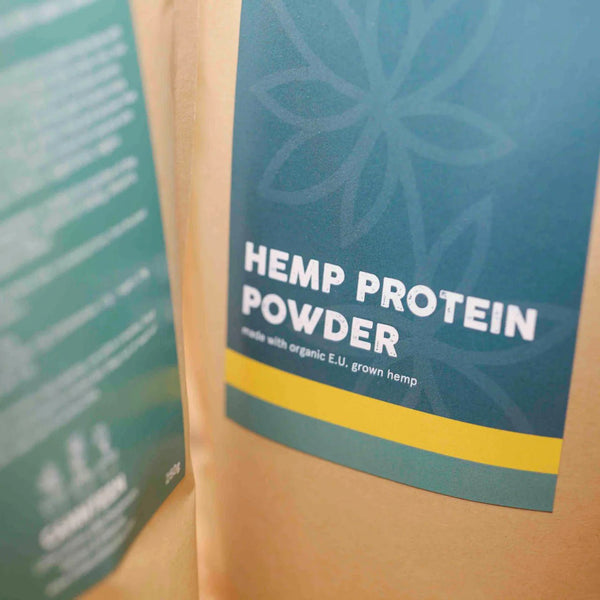 Front label of Little Collins Hemp Protein Powder showing product name and minimalist packaging design.