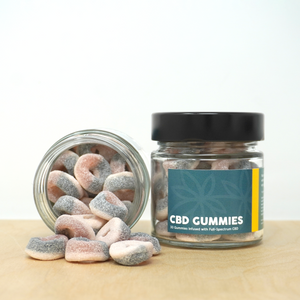 Little Collins CBD Gummies. One open jar and one closed.