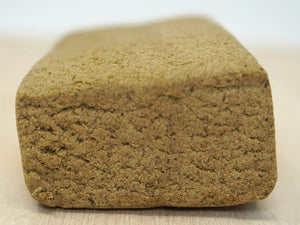 piece of Hollandaze CBD Hash and a counter top.