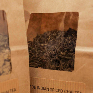 Close-up of Little Collins Indian Spiced Chai Tea front label showing branding and premium packaging design.